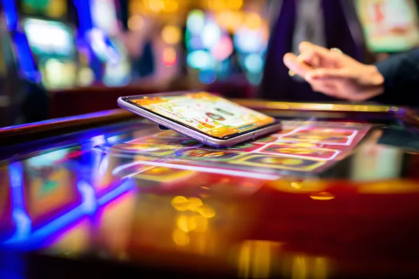 A person using their device against a moody casino-themed background, illustrating the smooth re-entry process at 5666BEF.
